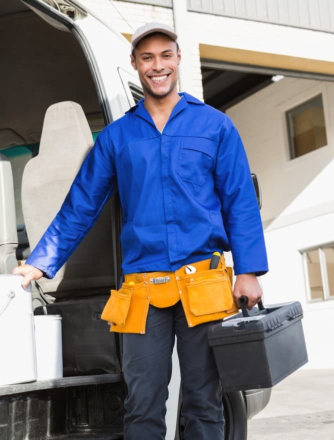 Service business owner standing by work van